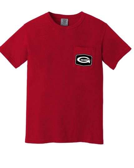 A red short-sleeve crewneck pocket t-shirt with a black and white graphic patch on the left chest pocket, displayed on a solid white background.